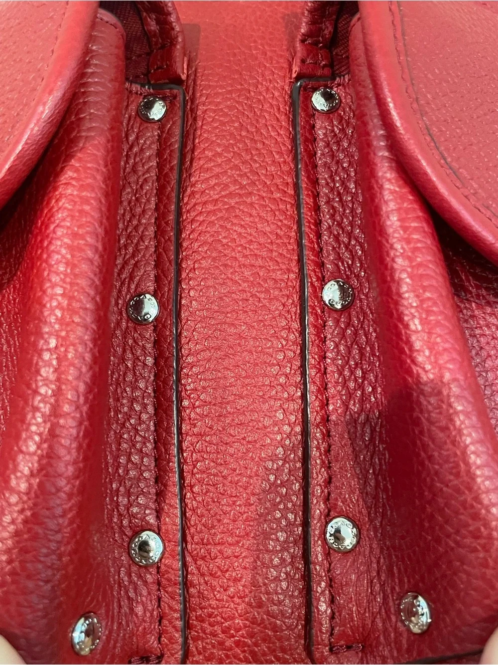 Coach EUC Red Pebble Leather Turnlock Backpack with stud pocket detail. ♥️ ❤️